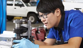 Person working on automotive equipment