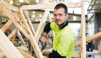 Person working on woodwork structure
