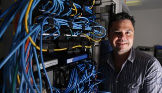 Person next to networking cables