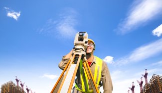 Person using surveying equipment